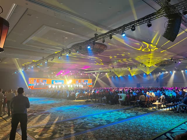 Large corporate event production with stage lighting