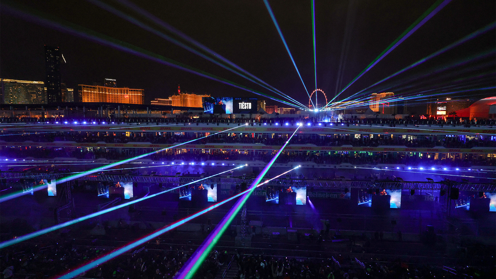 Large-scale Las Vegas outdoor event with laser beams across the skyline